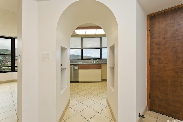 1221 Victoria St Unit 2301, Honolulu, HI 96814 - hall featuring light tile patterned floors and arched walkways