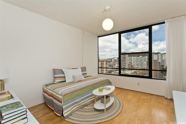 1221 Victoria St Unit 2301, Honolulu, HI 96814 - bedroom featuring light wood finished floors and a view of city