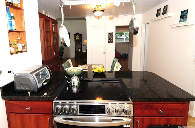 47-643 Hui Ulili St, Kaneohe, HI 96744 - kitchen featuring electric stove, dark brown cabinets, and dark stone countertops