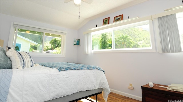 47-643 Hui Ulili St, Kaneohe, HI 96744 - bedroom with wood finished floors, vaulted ceiling, and a ceiling fan