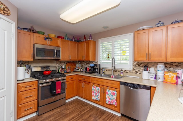 91-1268 Kilipue St, Ewa Beach, HI 96706 - kitchen featuring stainless steel appliances, light countertops, tasteful backsplash, and wood finished floors