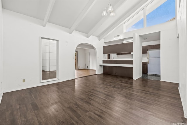 94-011 Kuahelani Ave Unit 135, Mililani, HI 96789 - unfurnished living room with high vaulted ceiling, arched walkways, beam ceiling, and dark wood-style flooring