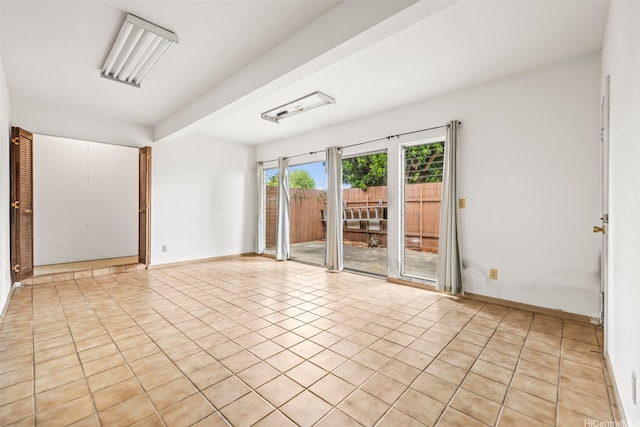 94-011 Kuahelani Ave Unit 135, Mililani, HI 96789 - empty room featuring light tile patterned floors and baseboards