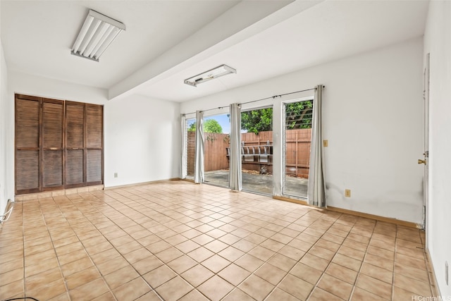 94-011 Kuahelani Ave Unit 135, Mililani, HI 96789 - spare room featuring light tile patterned floors and baseboards