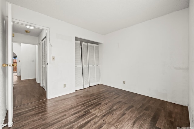 94-011 Kuahelani Ave Unit 135, Mililani, HI 96789 - unfurnished bedroom with dark wood-style flooring