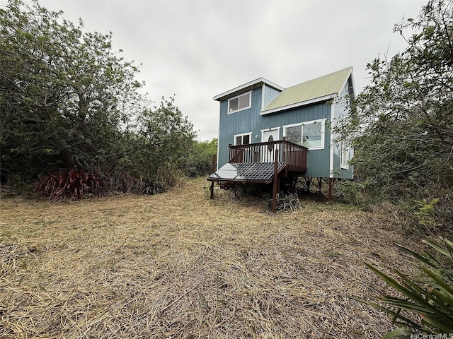 94-6342 Makai St, Naalehu, HI 96772 - rear view of house featuring a wooden deck