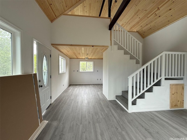 94-6342 Makai St, Naalehu, HI 96772 - foyer entrance featuring a wood ceiling with exposed beams, wood finished floors, stairway, and high vaulted ceiling