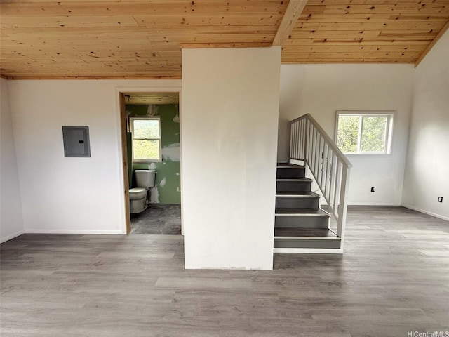 94-6342 Makai St, Naalehu, HI 96772 - staircase featuring wood ceiling, electric panel, wood finished floors, and vaulted ceiling