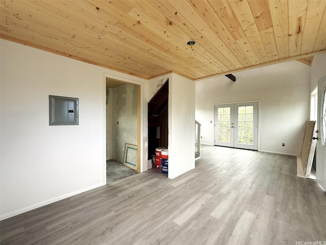 94-6342 Makai St, Naalehu, HI 96772 - unfurnished living room with electric panel, wood ceiling, french doors, and wood finished floors