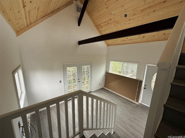 94-6342 Makai St, Naalehu, HI 96772 - stairs featuring high vaulted ceiling, a wooden ceiling with exposed beams, wood finished floors, and french doors