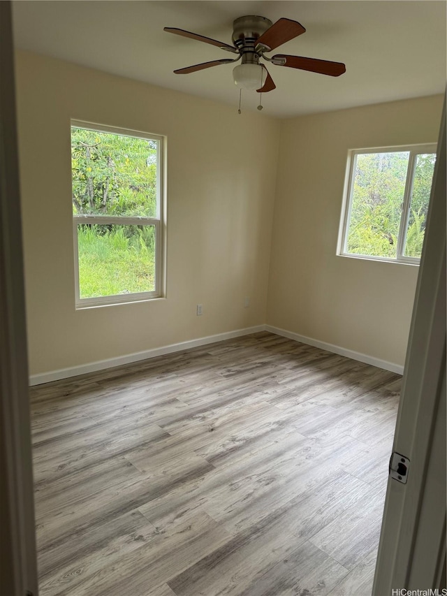 16-2075 Vista Dr, Pahoa, HI 96778 - unfurnished room with healthy amount of natural light, a ceiling fan, and wood finished floors