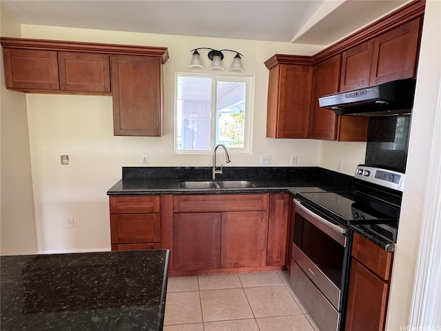 16-2075 Vista Dr, Pahoa, HI 96778 - kitchen with under cabinet range hood, stainless steel range with electric stovetop, dark stone counters, and light tile patterned floors