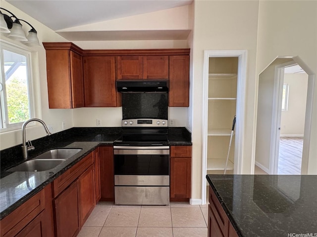 16-2075 Vista Dr, Pahoa, HI 96778 - kitchen featuring under cabinet range hood, stainless steel range with electric stovetop, lofted ceiling, dark stone countertops, and arched walkways