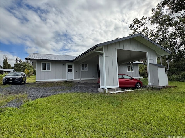 16-2075 Vista Dr, Pahoa, HI 96778 - view of front of home with a front lawn and board and batten siding