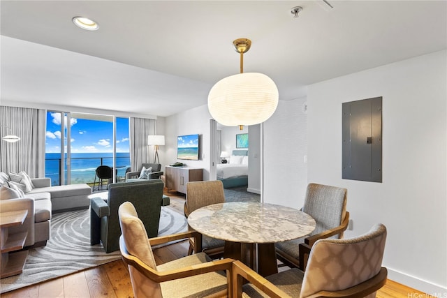 383 Kalaimoku St Unit 3109, Honolulu, HI 96815 - dining area featuring electric panel and wood finished floors