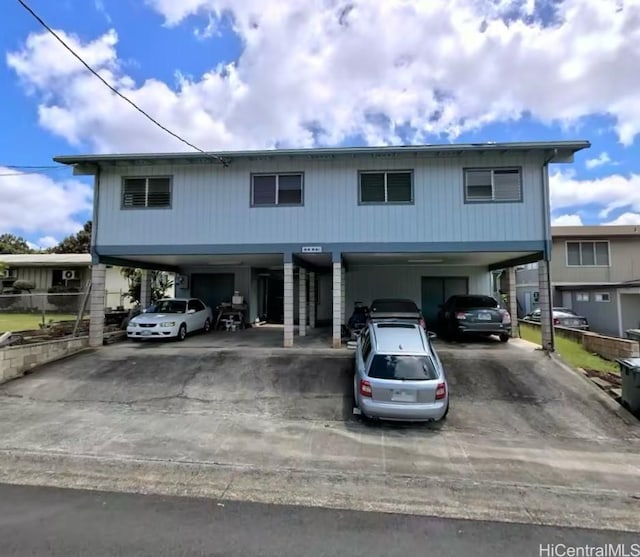 99-581 Honohina St, Aiea, HI 96701 - view of front of home with a carport and driveway