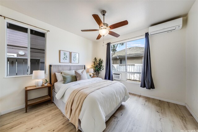 91-1033 Keokolo St Unit B, Kapolei, HI 96707 - bedroom featuring light wood-style floors, an AC wall unit, and ceiling fan