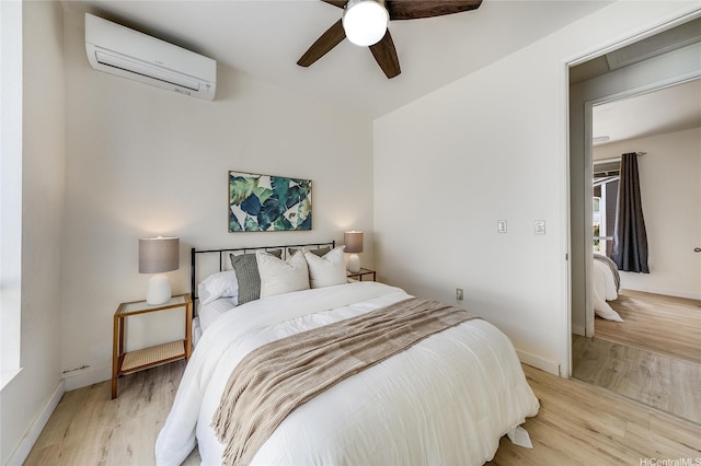 91-1033 Keokolo St Unit B, Kapolei, HI 96707 - bedroom featuring an AC wall unit, light wood-type flooring, and a ceiling fan