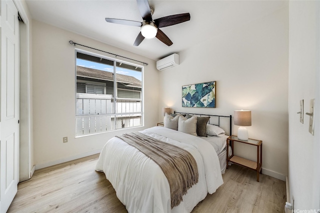 91-1033 Keokolo St Unit B, Kapolei, HI 96707 - bedroom with light wood-type flooring, a wall unit AC, and ceiling fan