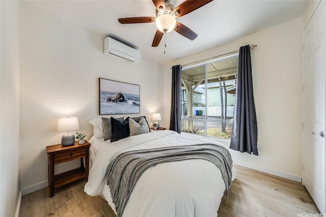 91-1033 Keokolo St Unit B, Kapolei, HI 96707 - bedroom with light wood-style flooring, an AC wall unit, and ceiling fan