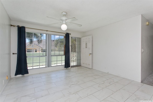 94-1475 Waipio Uka St Unit H206, Waipahu, HI 96797 - unfurnished room with light marble finish flooring, ceiling fan, and a textured ceiling