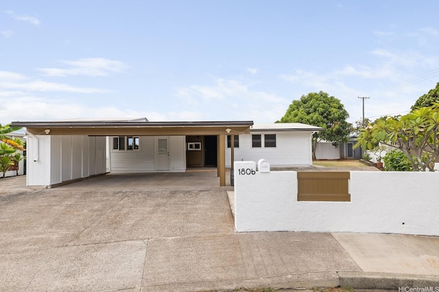 1806 Hoolaa Way, Pearl City, HI 96782 - ranch-style home with an attached carport, a fenced front yard, and driveway