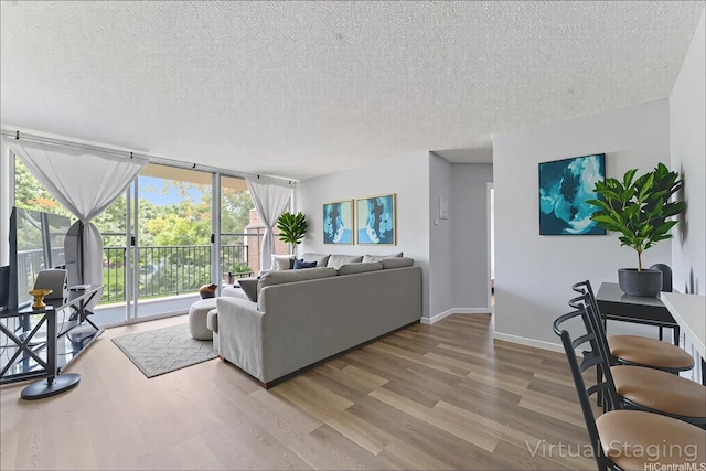 95-2035 Waikalani Pl Unit B303, Mililani, HI 96789 - living room with wood finished floors, a textured ceiling, and expansive windows