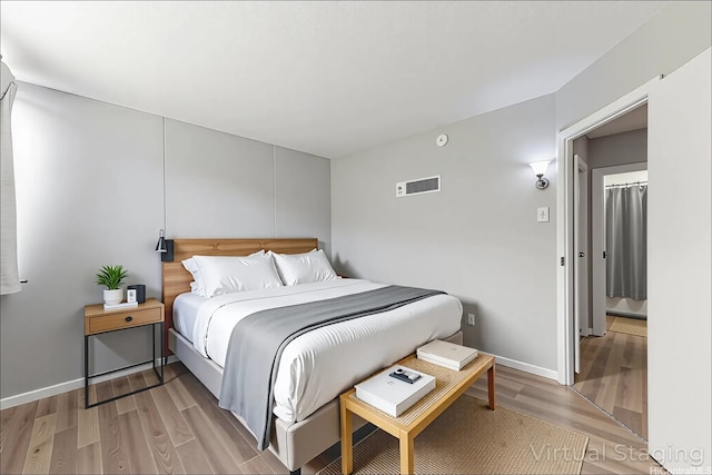 95-2035 Waikalani Pl Unit B303, Mililani, HI 96789 - bedroom with light wood-style flooring and baseboards