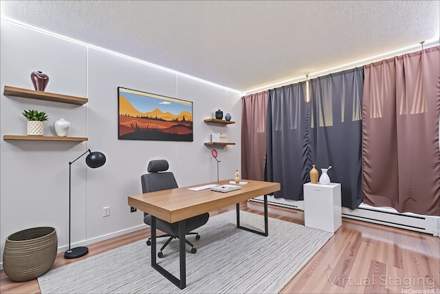 95-2035 Waikalani Pl Unit B303, Mililani, HI 96789 - office area featuring a baseboard heating unit, wood finished floors, baseboard heating, and a textured ceiling