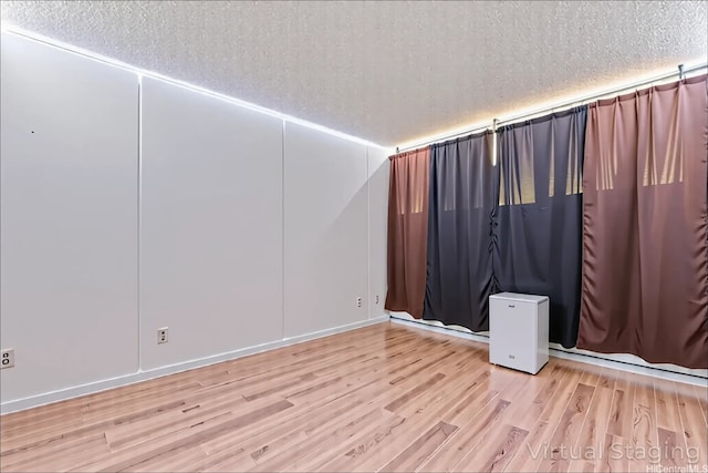 95-2035 Waikalani Pl Unit B303, Mililani, HI 96789 - unfurnished room with a textured ceiling and wood finished floors
