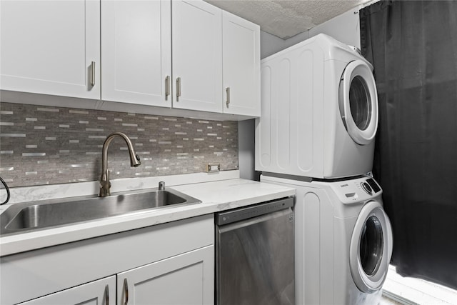 95-2035 Waikalani Pl Unit B303, Mililani, HI 96789 - laundry room with estacked washer and dryer and a textured ceiling