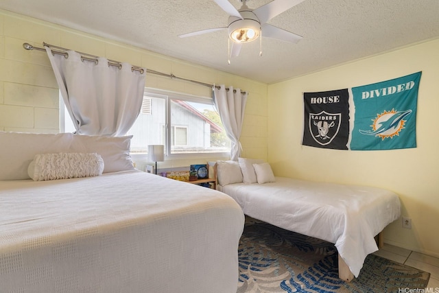 55-439 Naniloa Loop, Laie, HI 96762 - bedroom with a textured ceiling, a ceiling fan, and tile patterned flooring