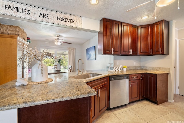 55-439 Naniloa Loop, Laie, HI 96762 - kitchen with stainless steel dishwasher, a ceiling fan, light tile patterned floors, light stone counters, and a textured ceiling