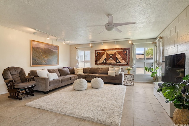 55-439 Naniloa Loop, Laie, HI 96762 - living area with track lighting, ceiling fan, light tile patterned floors, a textured ceiling, and healthy amount of natural light