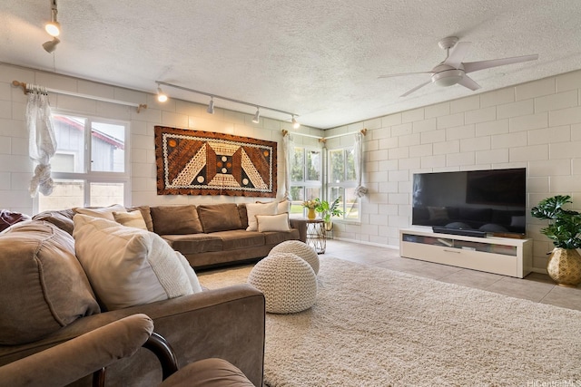 55-439 Naniloa Loop, Laie, HI 96762 - living room featuring track lighting, ceiling fan, light tile patterned floors, and a textured ceiling