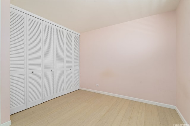 469 Ena Rd Unit 3208, Honolulu, HI 96815 - unfurnished bedroom with wood finished floors and a closet