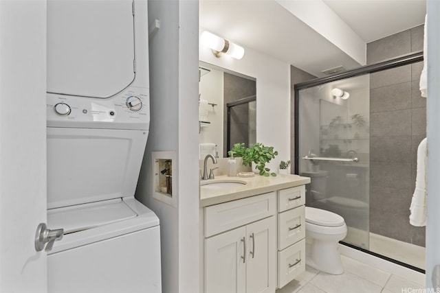 469 Ena Rd Unit 3208, Honolulu, HI 96815 - full bath featuring stacked washer and clothes dryer, vanity, tile patterned flooring, and a stall shower