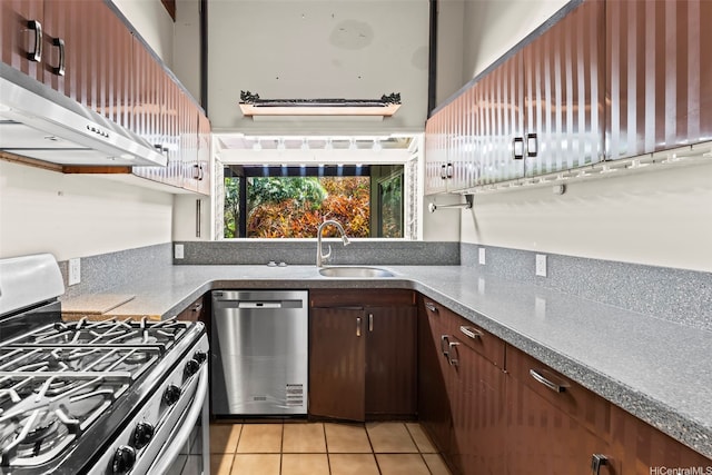 222 Kawaikui Pl, Honolulu, HI 96821 - kitchen with stainless steel appliances, light tile patterned floors, extractor fan, and dark brown cabinetry