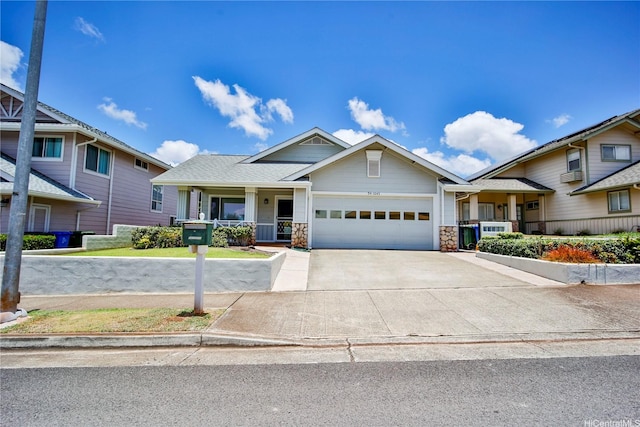 94-1043 Alelo St, Waipahu, HI 96797 - view of front of home featuring driveway, an attached garage, covered porch, and stone siding