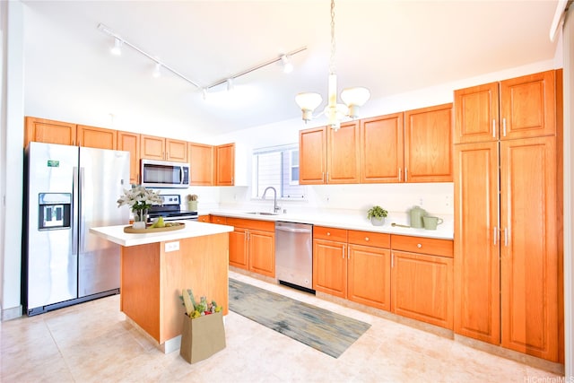 94-1043 Alelo St, Waipahu, HI 96797 - kitchen with appliances with stainless steel finishes, rail lighting, light countertops, a center island, and a chandelier