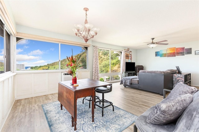 1022 Prospect St Unit 704A, Honolulu, HI 96822 - home office featuring a chandelier, light wood-style flooring, and a ceiling fan