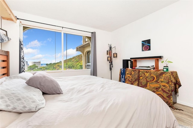 1022 Prospect St Unit 704A, Honolulu, HI 96822 - bedroom featuring wood finished floors and baseboards