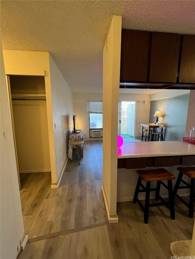 1616 Kewalo St Unit 303, Honolulu, HI 96822 - kitchen with wood finished floors and a textured ceiling