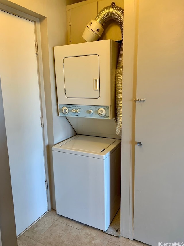 1616 Kewalo St Unit 303, Honolulu, HI 96822 - laundry area featuring estacked washer and dryer and light tile patterned flooring