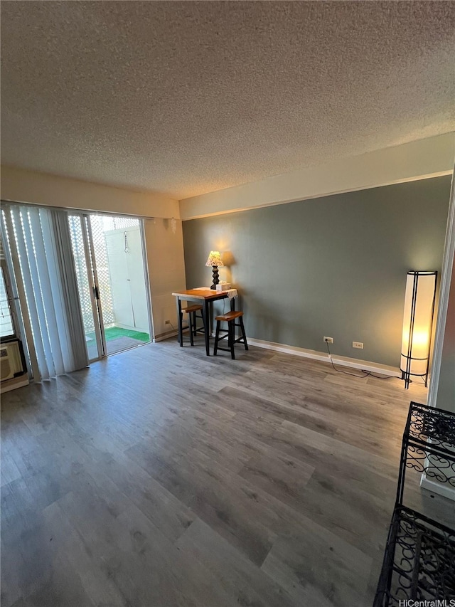1616 Kewalo St Unit 303, Honolulu, HI 96822 - dining space featuring a textured ceiling and wood finished floors