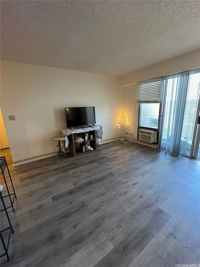 1616 Kewalo St Unit 303, Honolulu, HI 96822 - unfurnished living room with wood finished floors and a textured ceiling