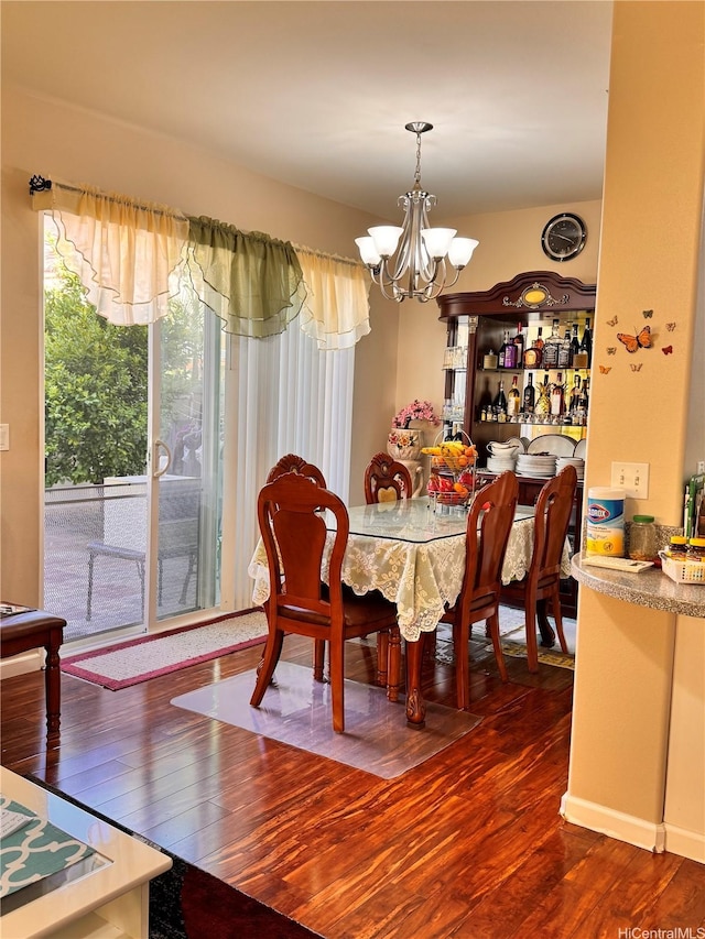91-1200 Keaunui Dr Unit 309, Ewa Beach, HI 96706 - dining space featuring a chandelier and wood finished floors