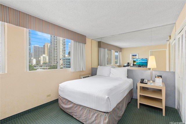 444 Kanekapolei St Unit 513, Honolulu, HI 96815 - carpeted bedroom with a textured ceiling