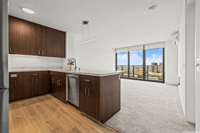 615 Keawe St Unit 3005, Honolulu, HI 96813 - kitchen with appliances with stainless steel finishes, expansive windows, a peninsula, a textured ceiling, and light countertops