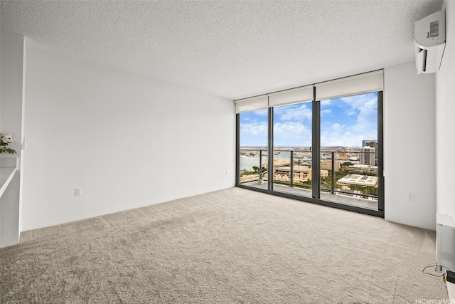 615 Keawe St Unit 3005, Honolulu, HI 96813 - carpeted empty room with expansive windows, a wall mounted air conditioner, and a textured ceiling